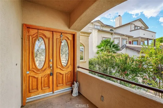 a view of a patio with couches and potted plants