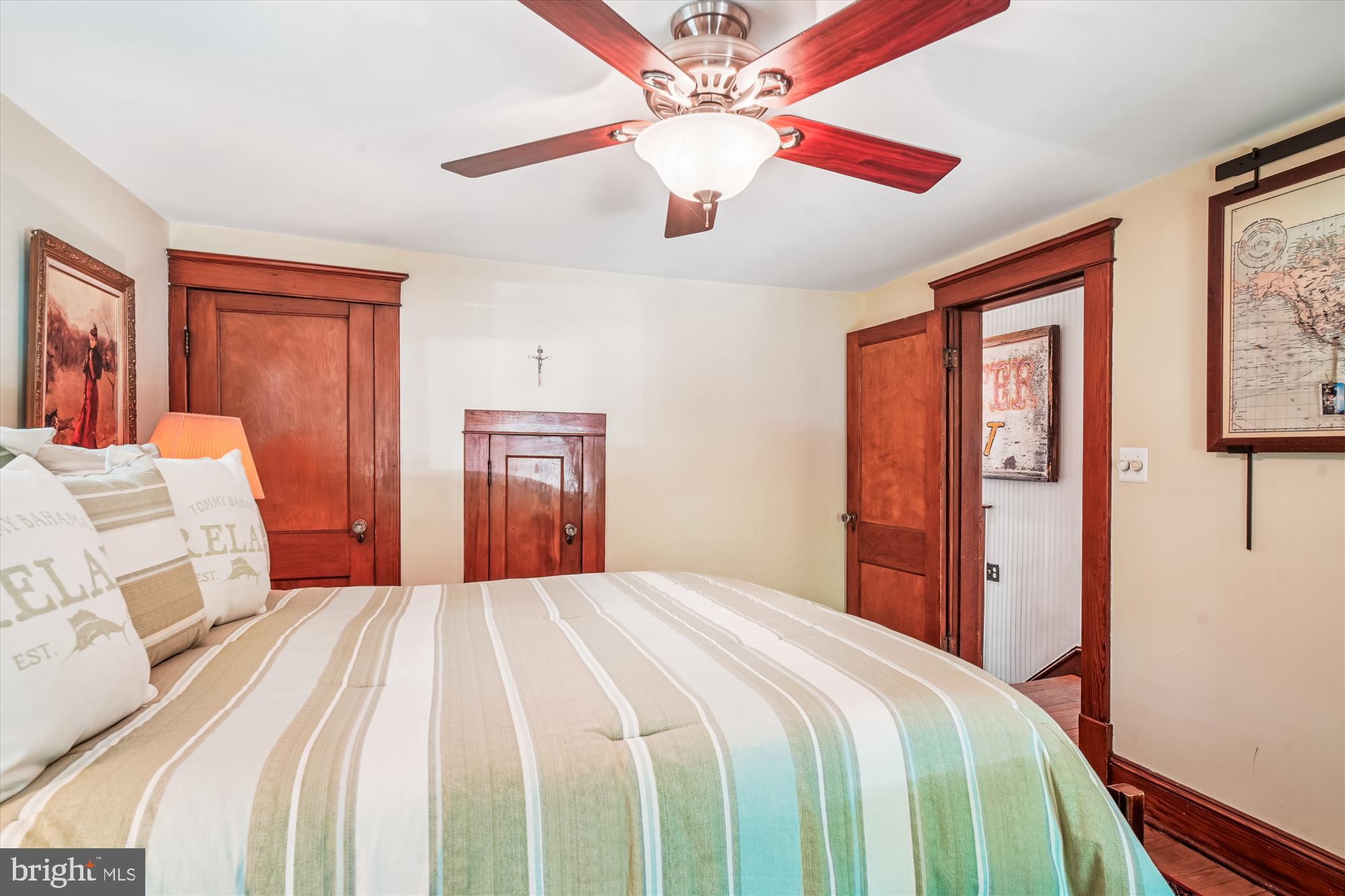 28411 Kemptown Road Damascus, MD 20872 - Photo 35 of 86 a bedroom with a large bed and wooden closet