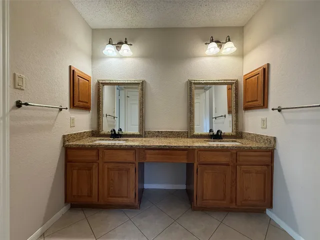 a white toilet sitting next to a bath tub
