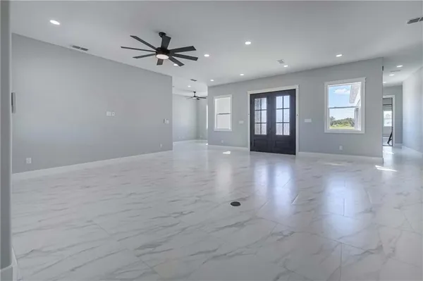 a view of a dining room with furniture and window