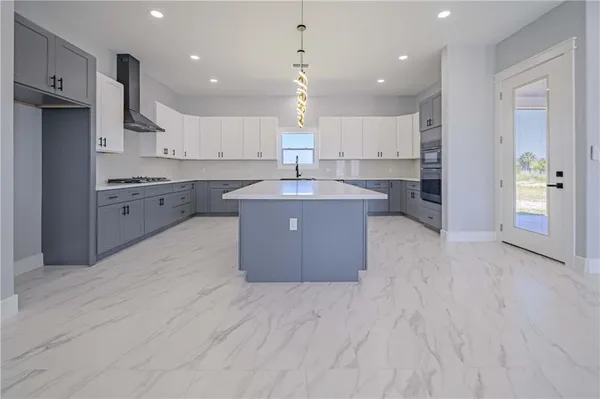 a kitchen with cabinets appliances and cabinets