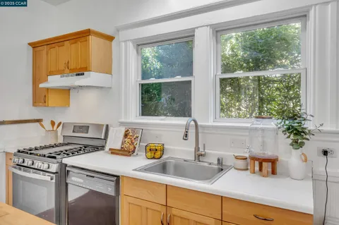 a view of a kitchen with refrigerator and washer
