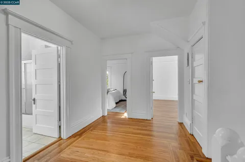 a view of an entryway and wooden floor