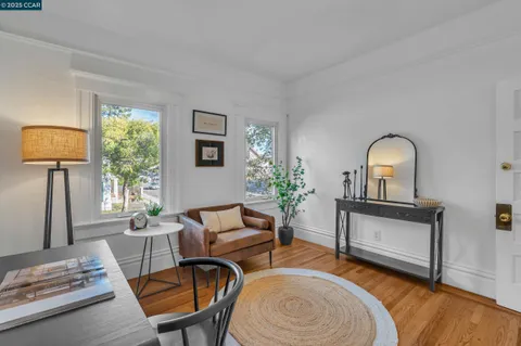 a bedroom with bed and a potted plant