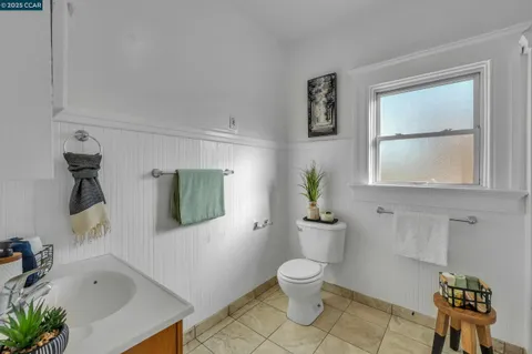 a bathroom with a window and a shower