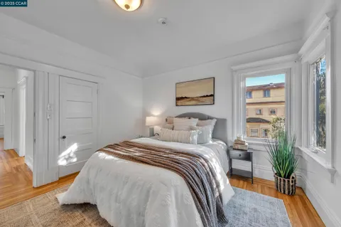 a bedroom with a bed and a table