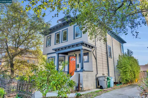 a view of a patio with couches table and chairs and potted plants