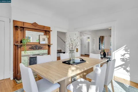 a kitchen with a table chairs and a stove