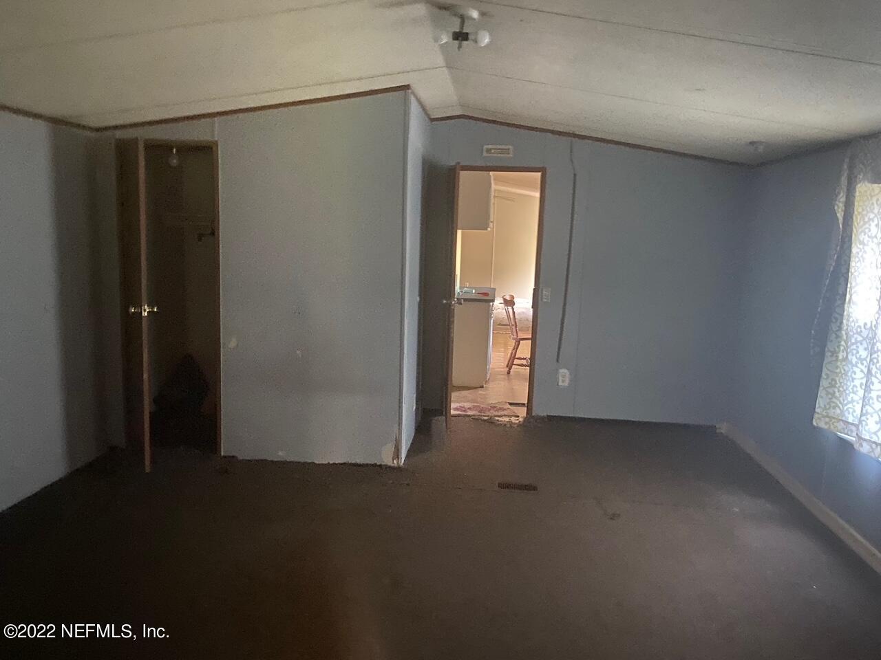 112 Pridgeon Street Interlachen, FL 32148 - Photo 12 of 21 an empty room with windows and closet