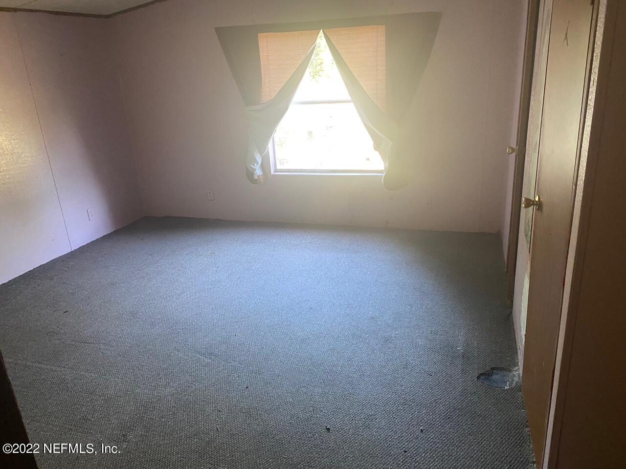 112 Pridgeon Street Interlachen, FL 32148 - Photo 18 of 21 an empty room with a window