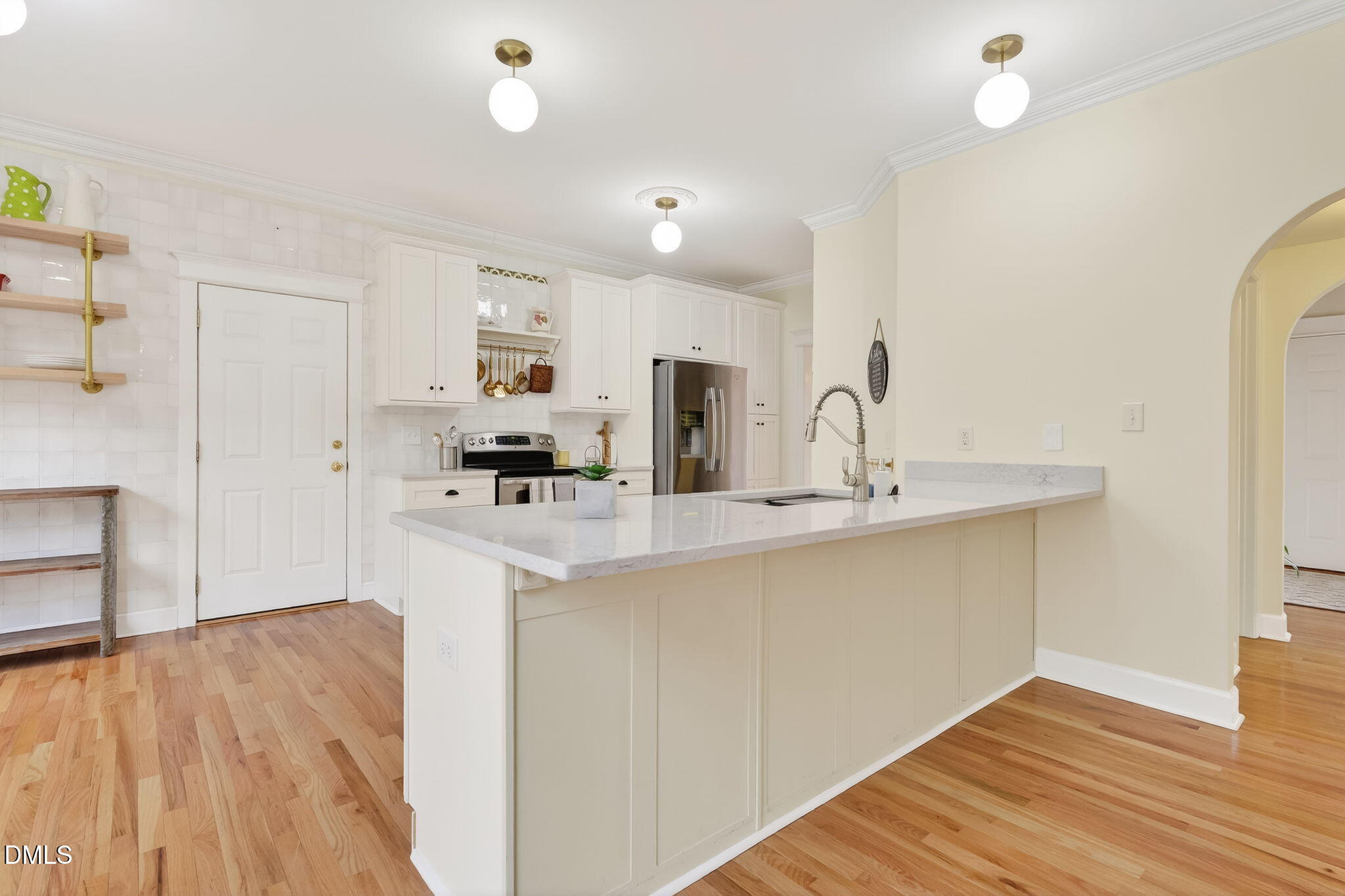 1328 Red Brick Road Garner, NC 27529 - Photo 14 of 64 a kitchen with stainless steel appliances a sink stove and cabinets
