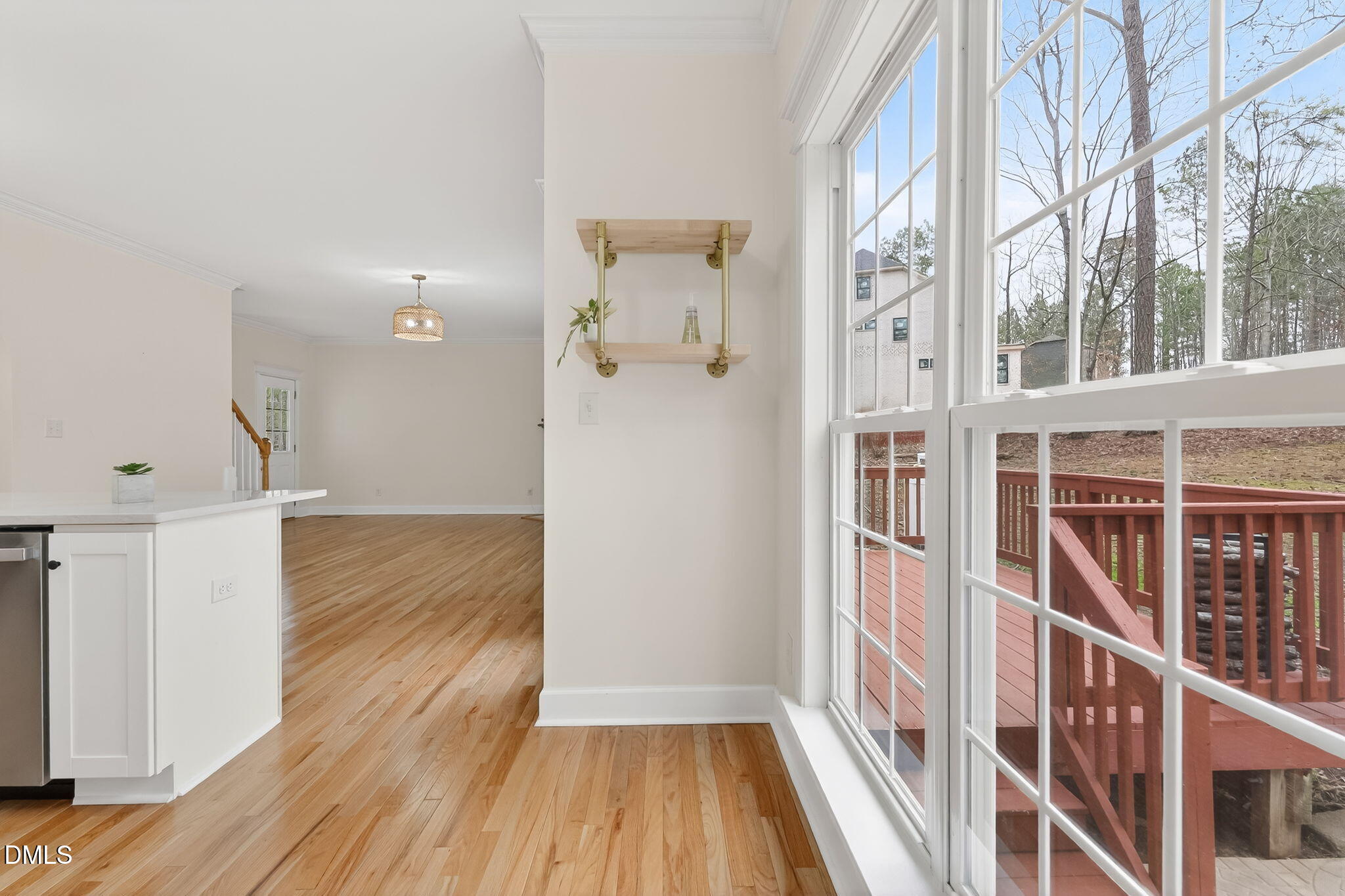 1328 Red Brick Road Garner, NC 27529 - Photo 16 of 64 a view of a hallway with wooden floor and staircase