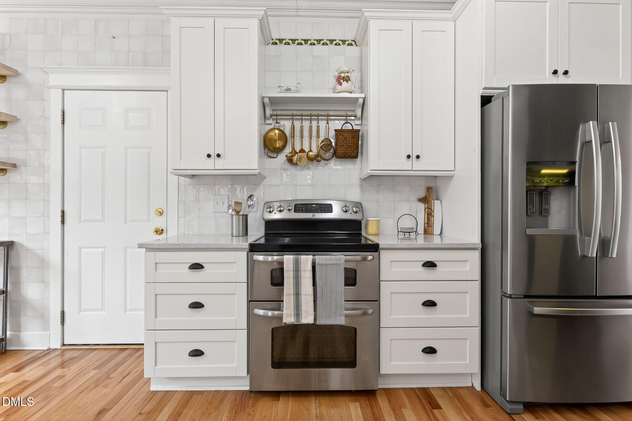 1328 Red Brick Road Garner, NC 27529 - Photo 20 of 64 a kitchen with a refrigerator and a stove