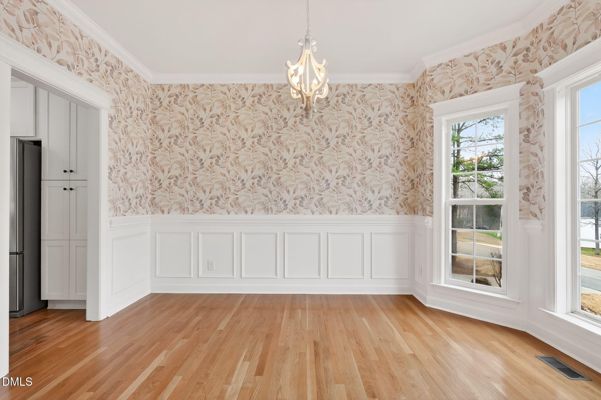 1328 Red Brick Road Garner, NC 27529 - Photo 26 of 64 a view of an empty room with wooden floor and a window