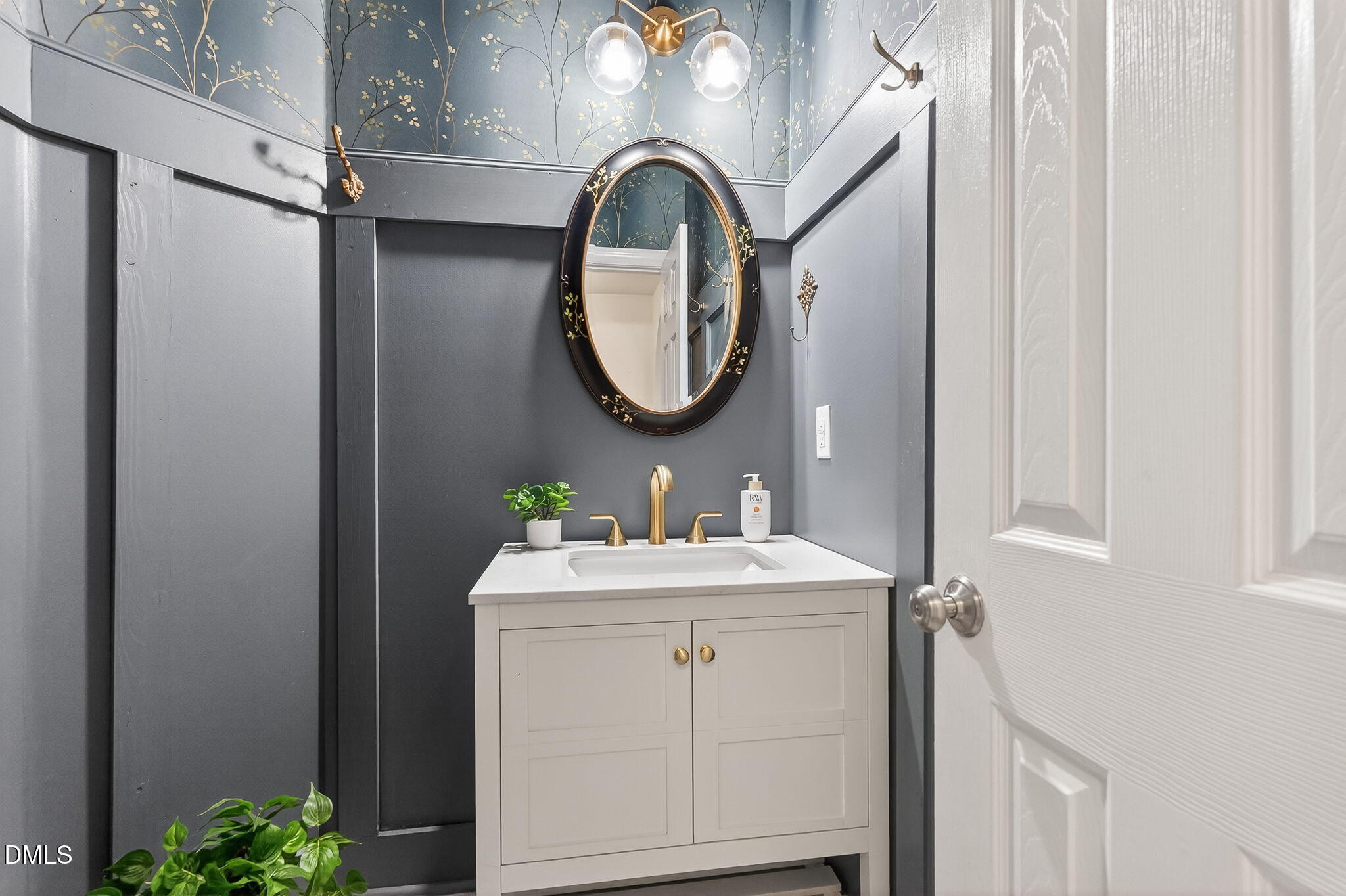 1328 Red Brick Road Garner, NC 27529 - Photo 28 of 64 a bathroom with a sink and a mirror