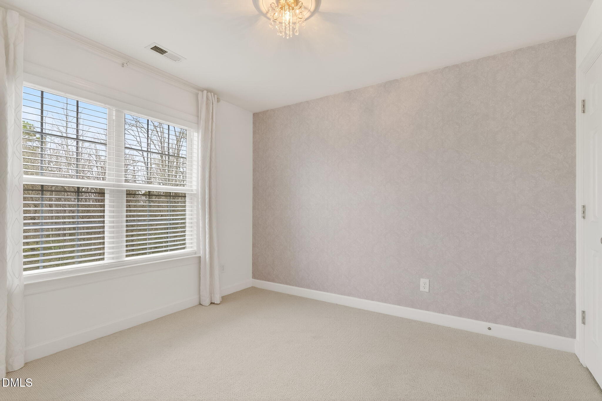 1328 Red Brick Road Garner, NC 27529 - Photo 29 of 64 a view of an empty room with a window
