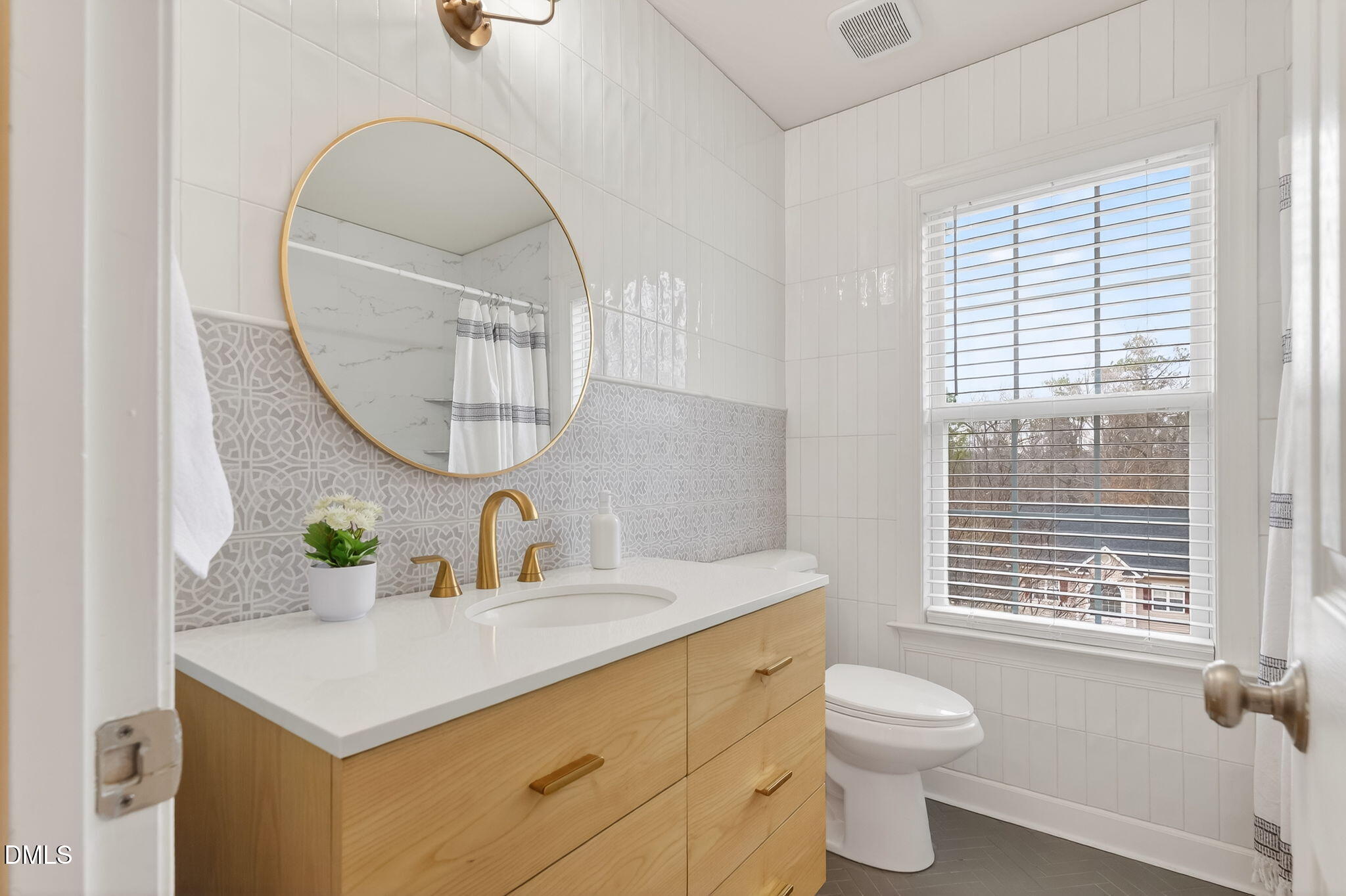 1328 Red Brick Road Garner, NC 27529 - Photo 32 of 64 a bathroom with a sink a toilet and a mirror