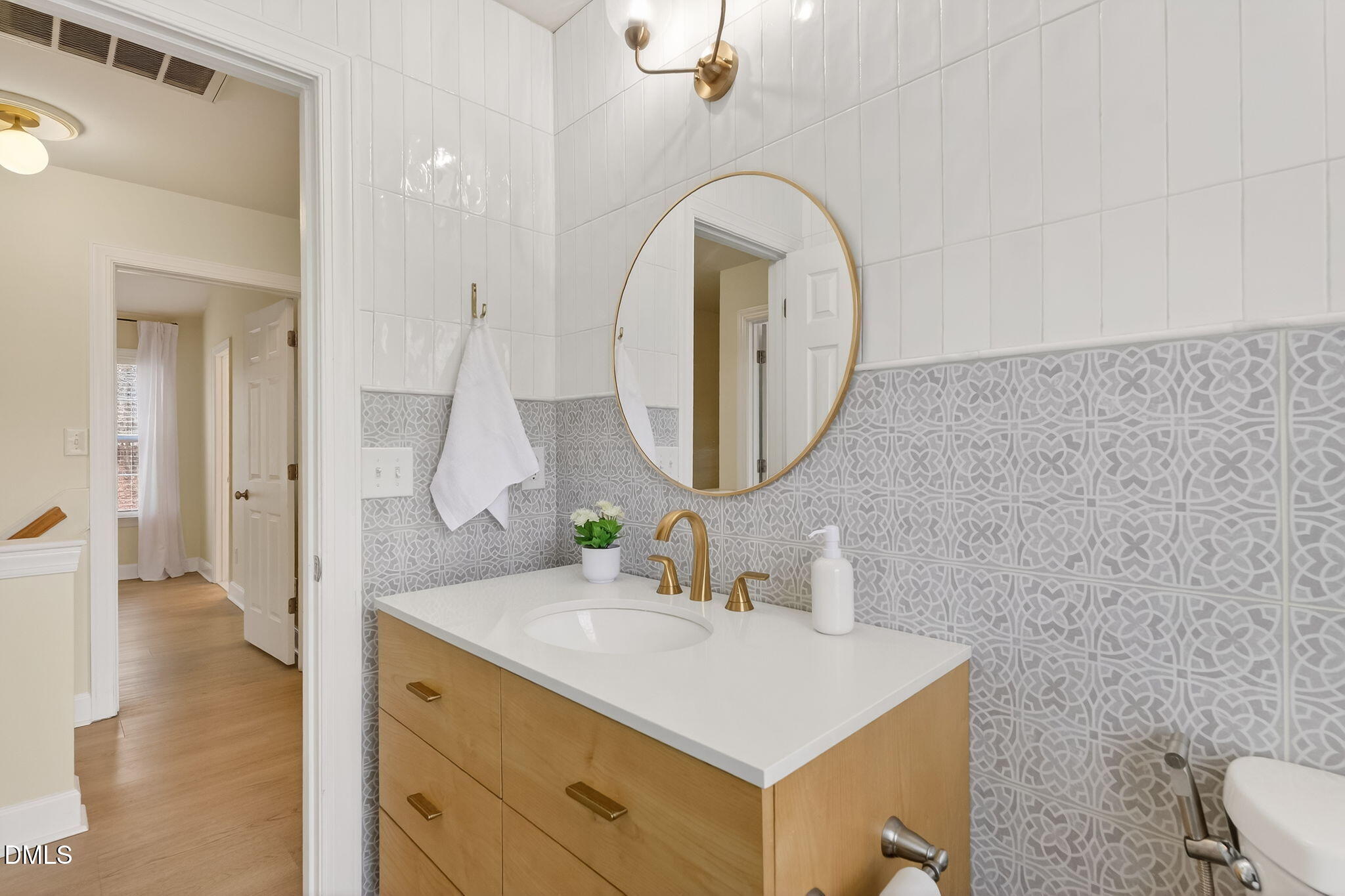 1328 Red Brick Road Garner, NC 27529 - Photo 34 of 64 a bathroom with a sink a toilet and a mirror