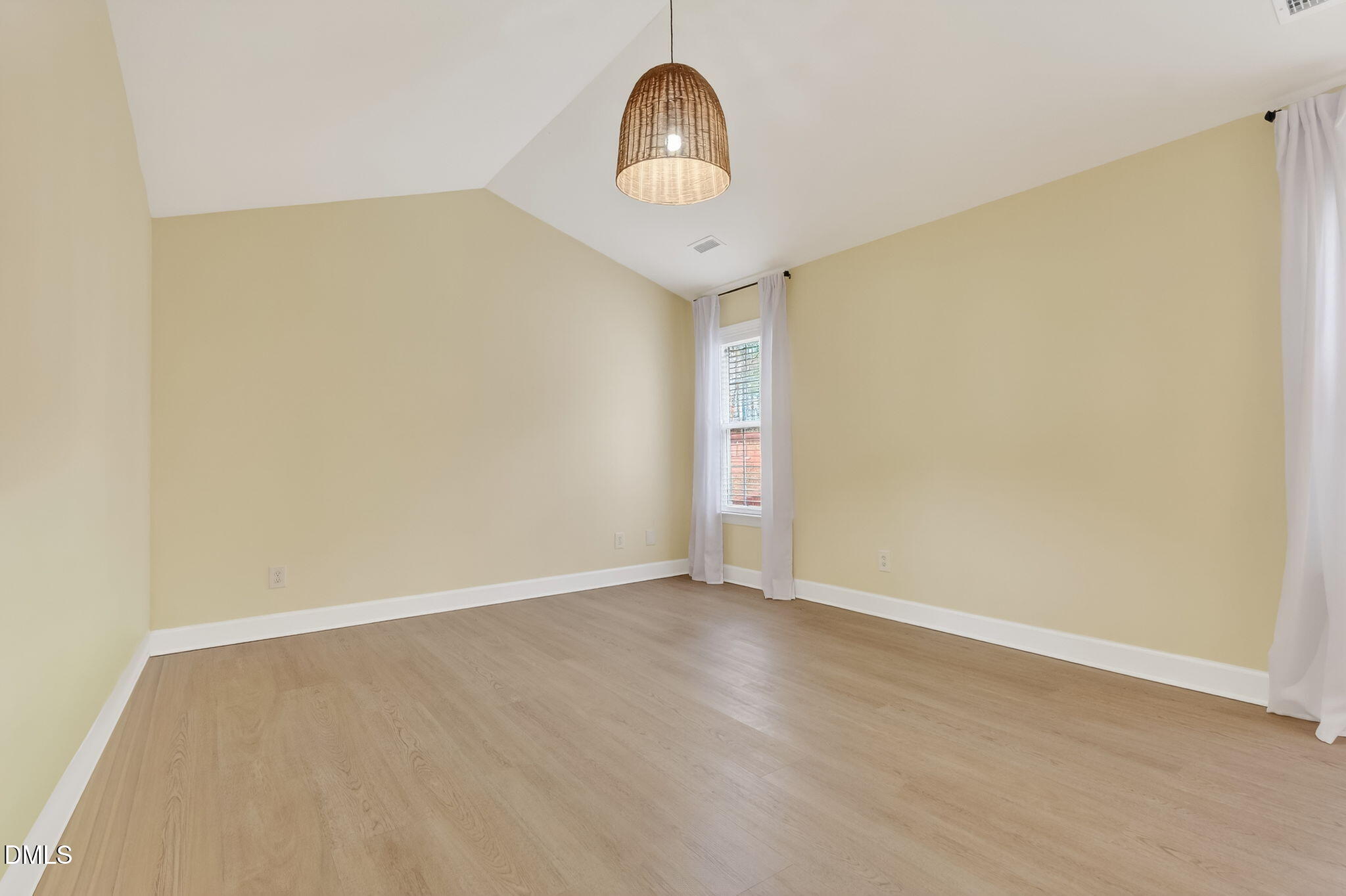 1328 Red Brick Road Garner, NC 27529 - Photo 37 of 64 a view of a room with wooden floor chandelier and a window