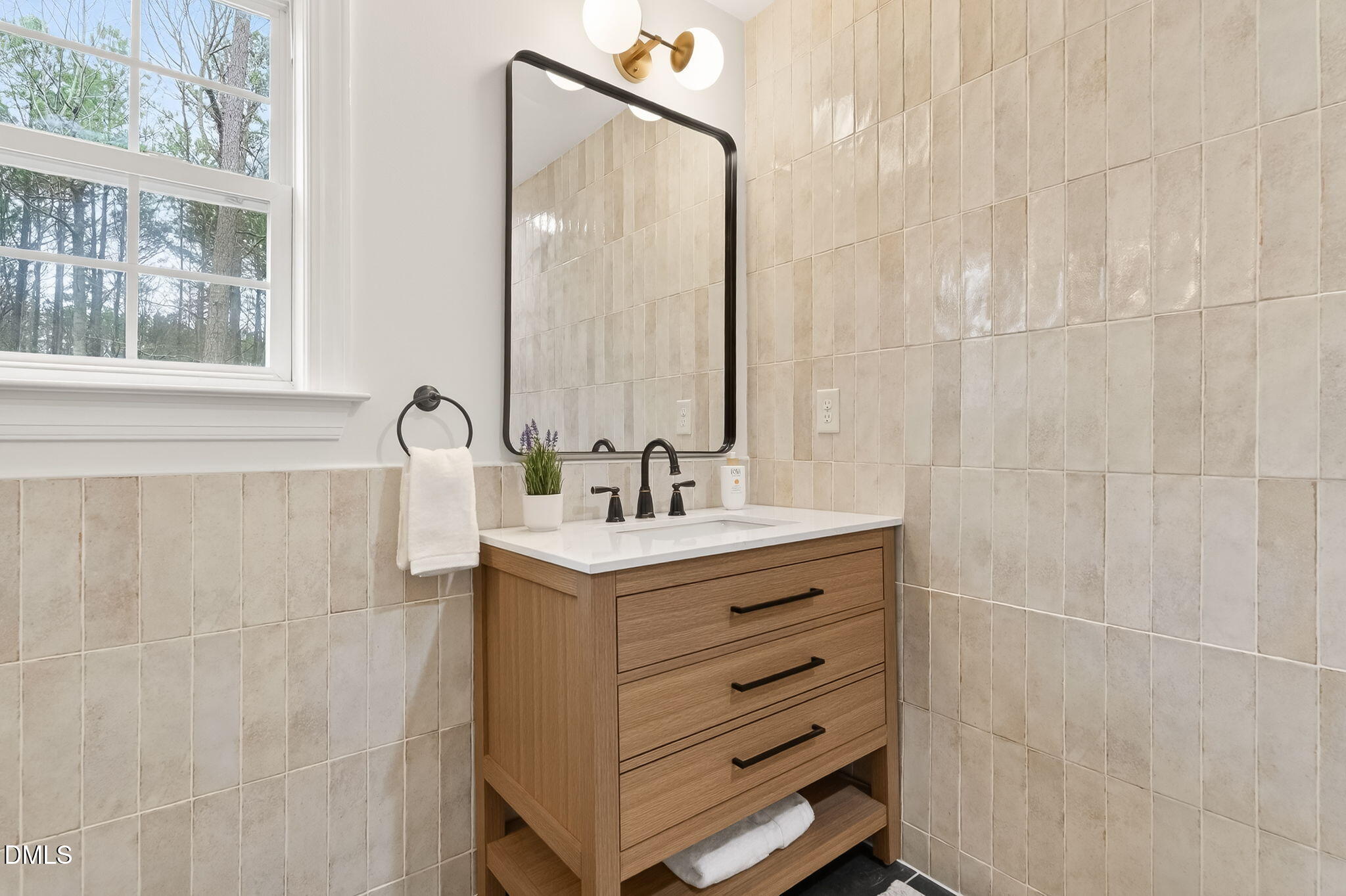 1328 Red Brick Road Garner, NC 27529 - Photo 42 of 64 a bathroom with a sink a mirror and a shower