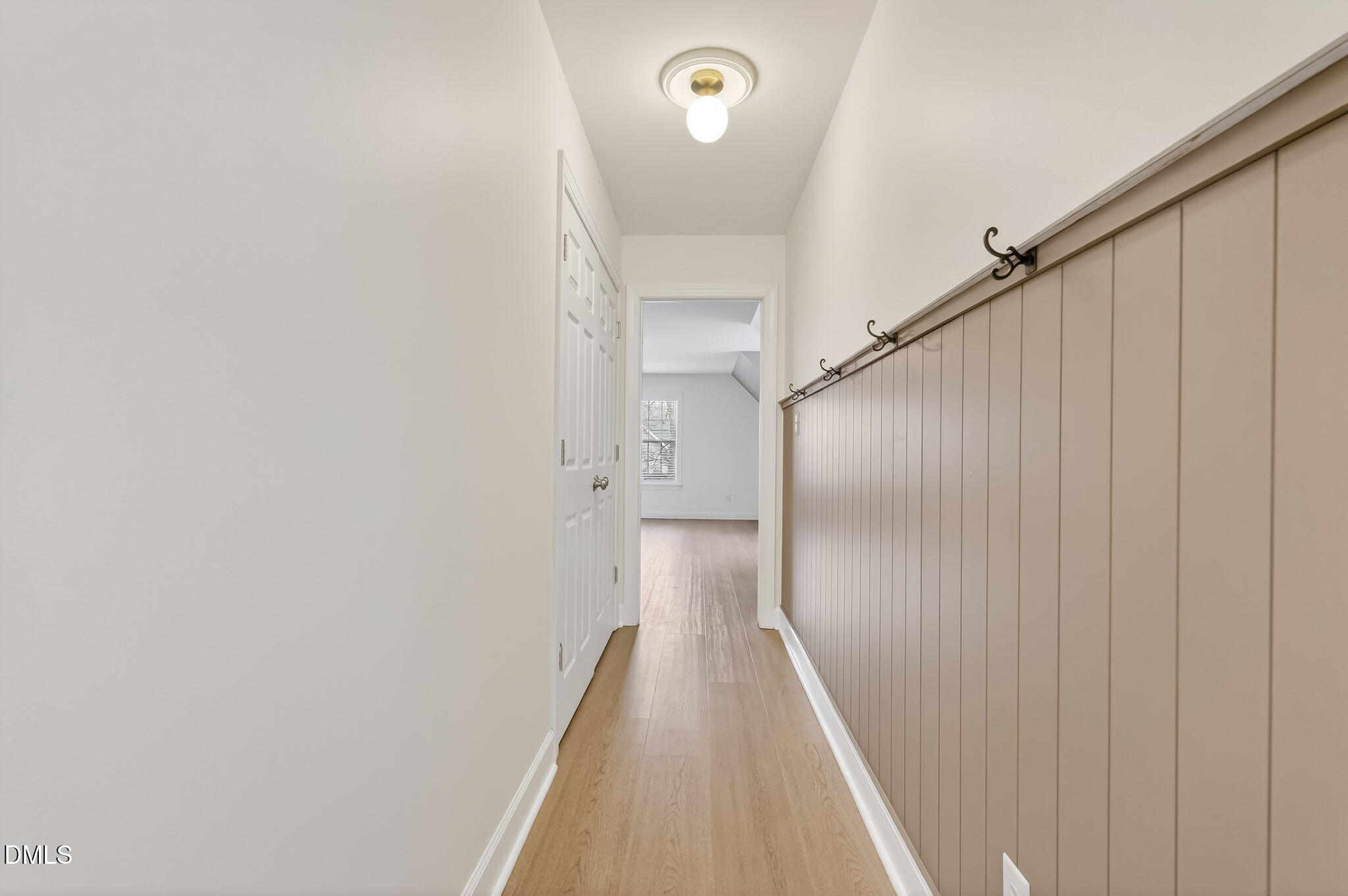 1328 Red Brick Road Garner, NC 27529 - Photo 44 of 64 a view of a hallway with wooden floor and entryway