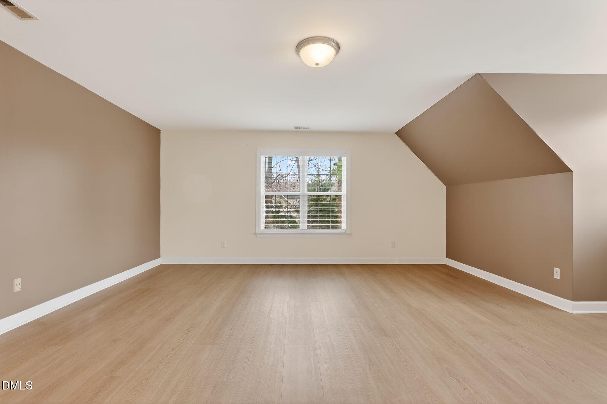 1328 Red Brick Road Garner, NC 27529 - Photo 46 of 64 an empty room with wooden floor and windows