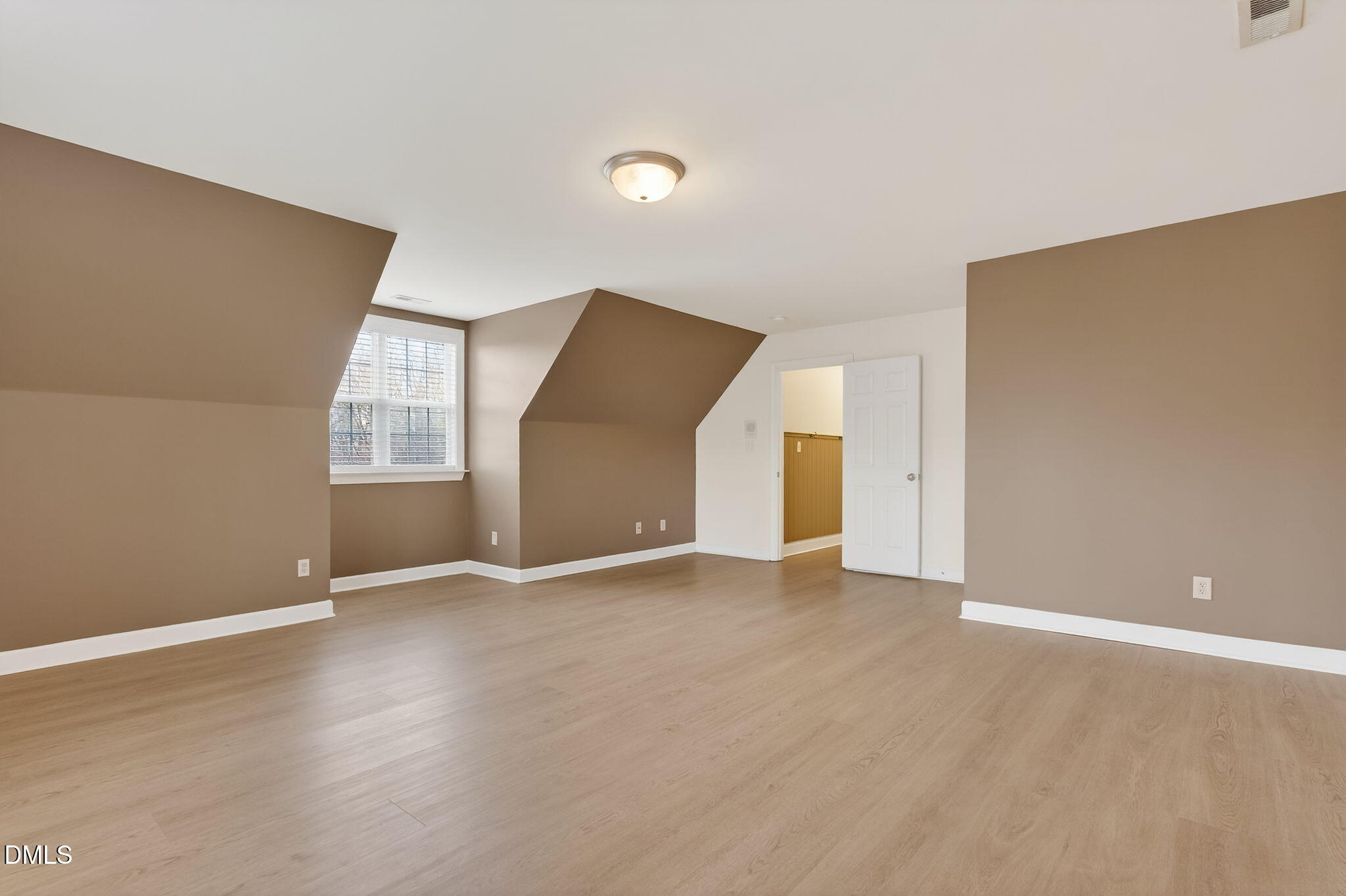 1328 Red Brick Road Garner, NC 27529 - Photo 47 of 64 an empty room with closet and windows