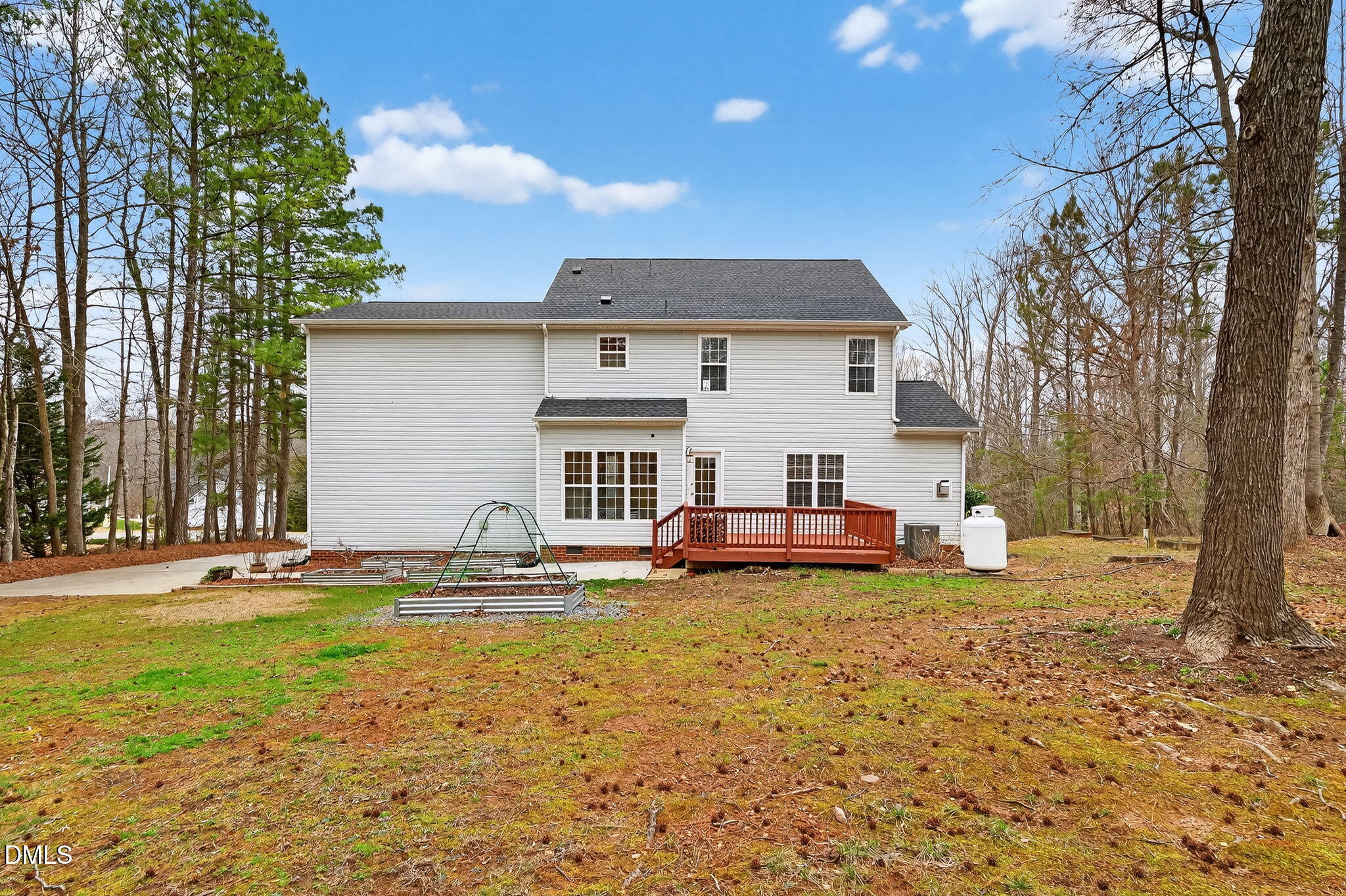 1328 Red Brick Road Garner, NC 27529 - Photo 53 of 64 a view of a house with a yard and sitting area
