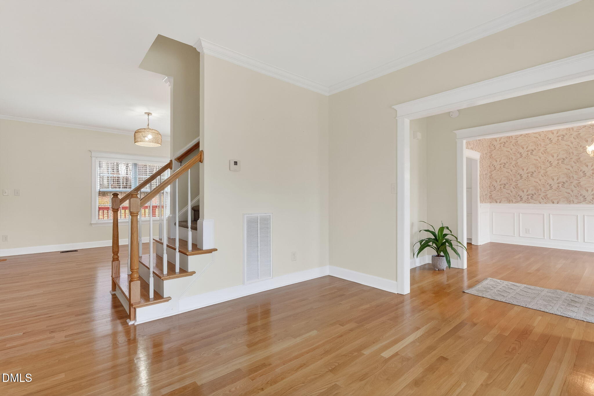 1328 Red Brick Road Garner, NC 27529 - Photo 9 of 64 a view of entryway and hall with wooden floor