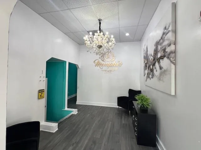 a view of a room with furniture and a chandelier