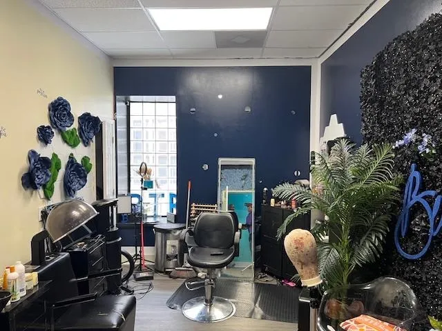 a living room with furniture and a mirror