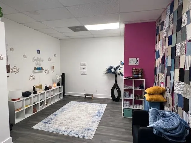 a living room with furniture and a rug