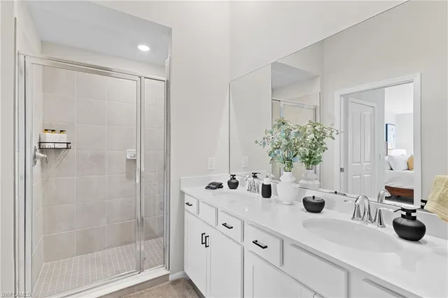 a bedroom with a bed and painting on the wall