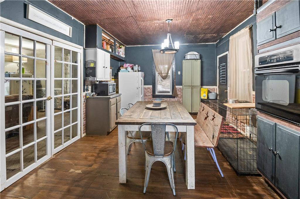 845 Mottern Road Punxsutawney, PA 15767 - Photo 11 of 40 a view of a dining room with furniture window and wooden floor