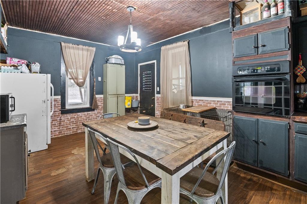 845 Mottern Road Punxsutawney, PA 15767 - Photo 12 of 40 a view of a dining room with furniture and wooden floor