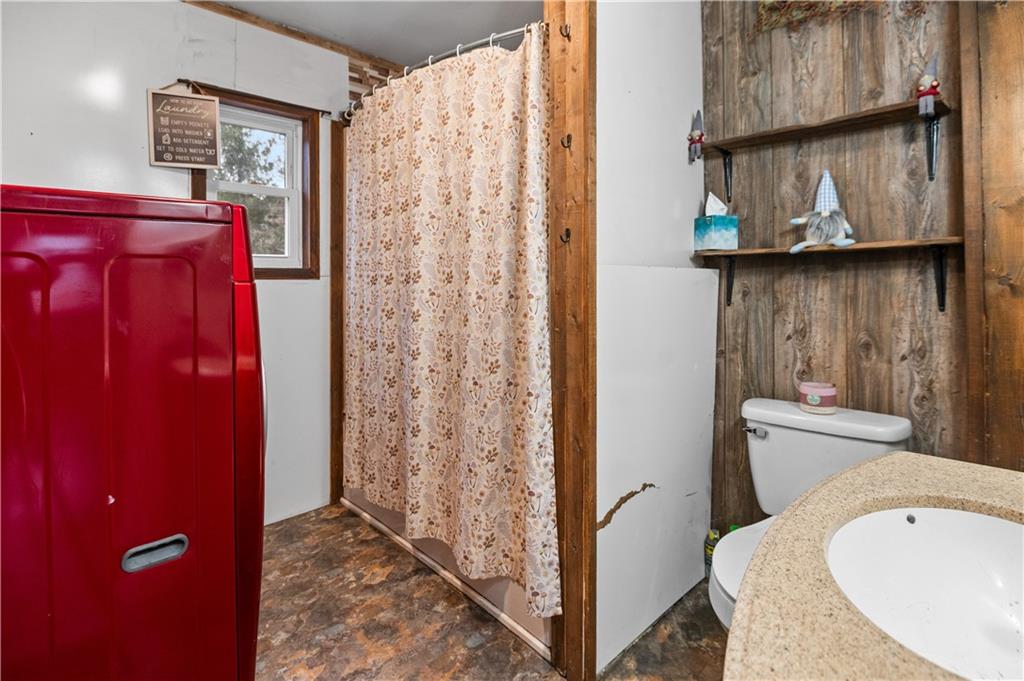 845 Mottern Road Punxsutawney, PA 15767 - Photo 18 of 40 a bathroom with a sink a toilet and shower curtain