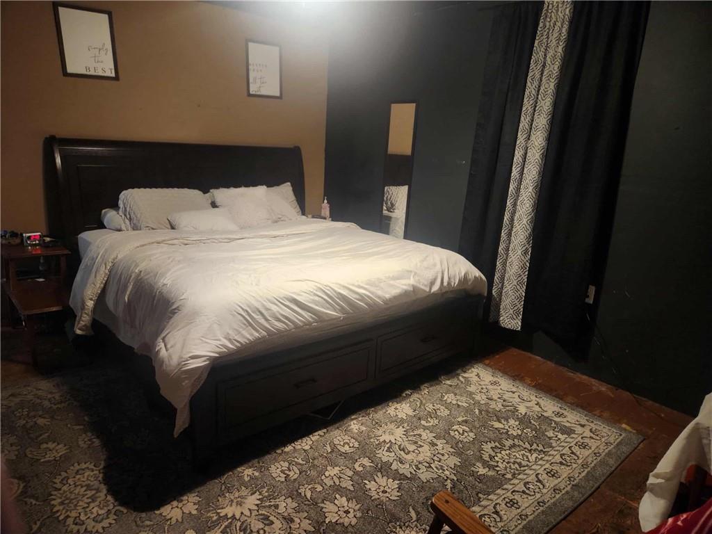 845 Mottern Road Punxsutawney, PA 15767 - Photo 20 of 37 a bed sitting in a bedroom next to a window