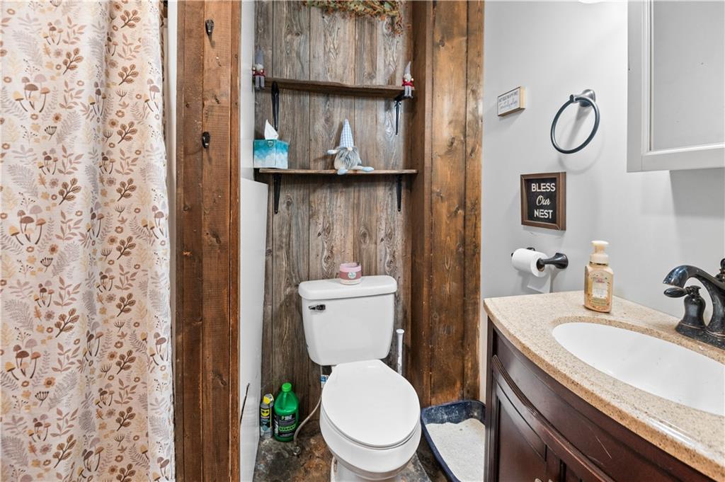 845 Mottern Road Punxsutawney, PA 15767 - Photo 21 of 40 a white toilet sitting next to a bathroom sink