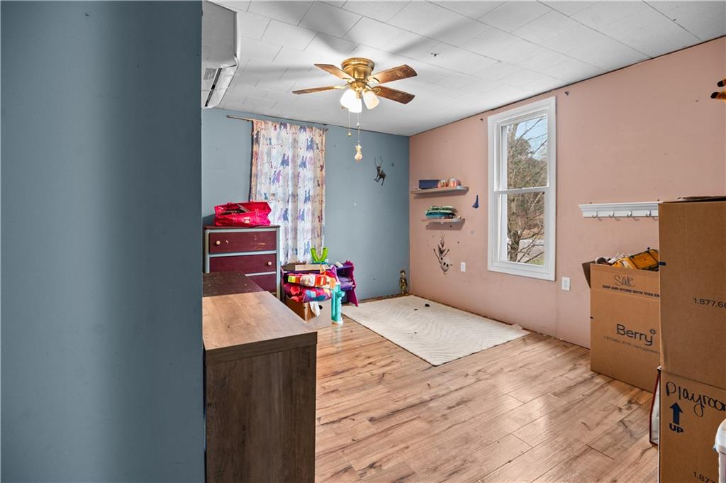 845 Mottern Road Punxsutawney, PA 15767 - Photo 22 of 40 a bedroom with a bed dresser and a window