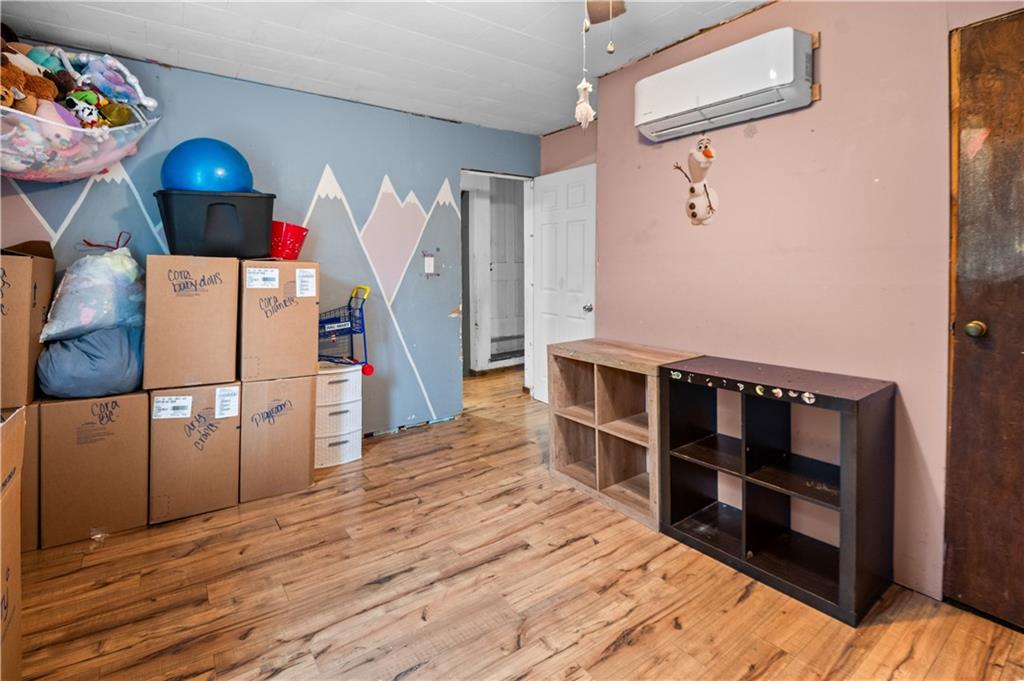 845 Mottern Road Punxsutawney, PA 15767 - Photo 24 of 40 a view of a bedroom with wooden floor and staircase