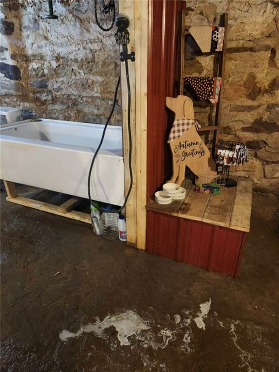 845 Mottern Road Punxsutawney, PA 15767 - Photo 26 of 37 a room with water heater and wooden floor