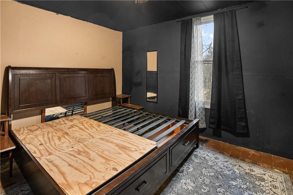 845 Mottern Road Punxsutawney, PA 15767 - Photo 28 of 40 a bed sitting in a bedroom next to a window