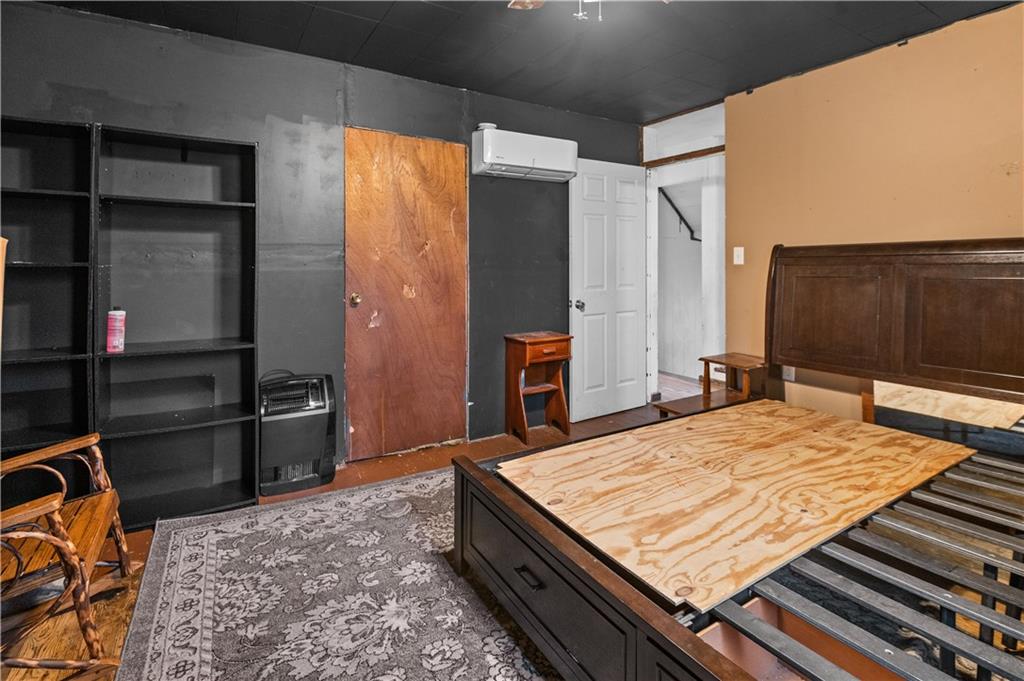 845 Mottern Road Punxsutawney, PA 15767 - Photo 29 of 40 a bed sitting in a bedroom next to a window