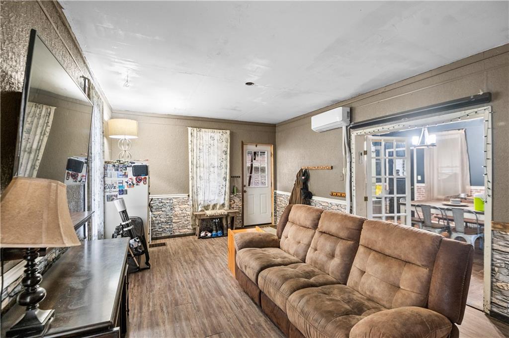 845 Mottern Road Punxsutawney, PA 15767 - Photo 8 of 40 a living room with furniture and a wooden floor