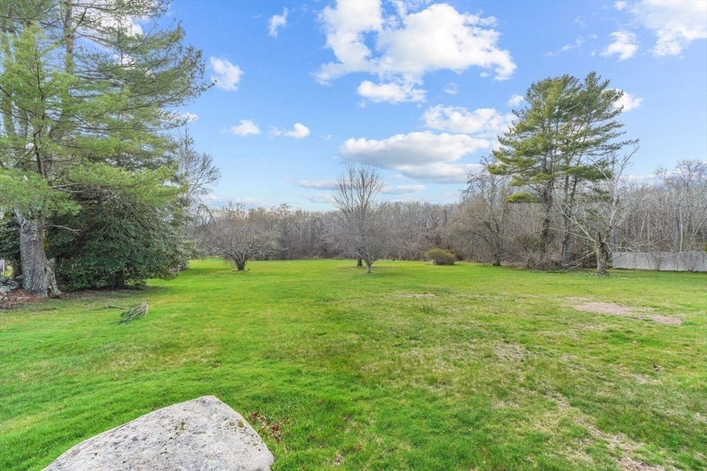49 Old Stone Church Road Little Compton, RI 02837 - Photo 6 of 27 a view of a field of grass and trees