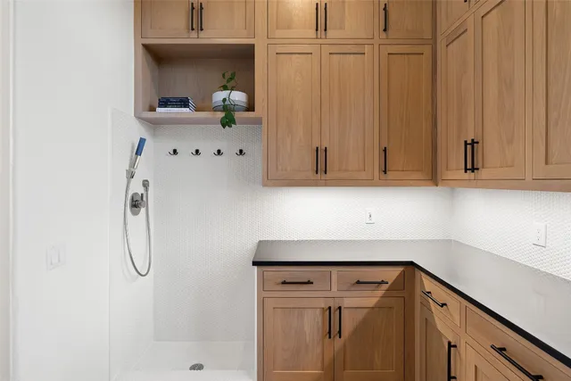 a bathroom with a sink vanity and a mirror