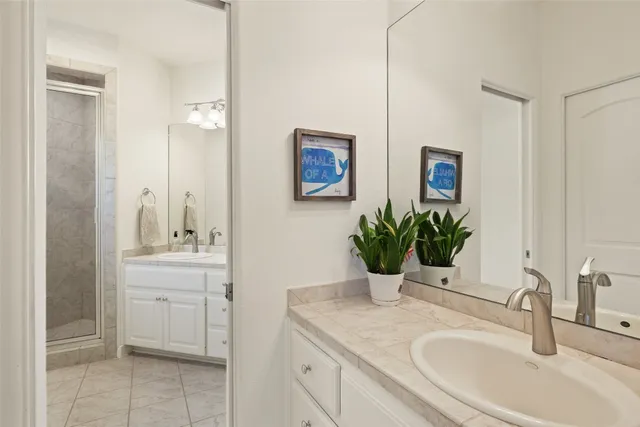 a bathroom with a sink a vanity and a mirror