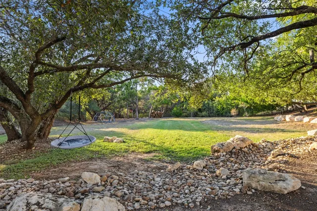 a view of swimming pool with a yard