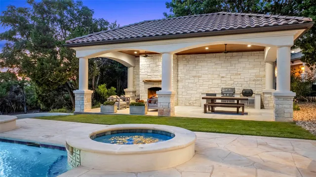 a view of a house with backyard tub and sink