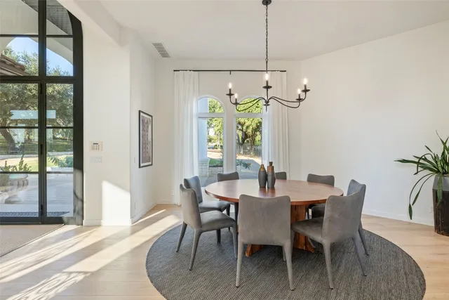 a view of a dining room with furniture window and outside view